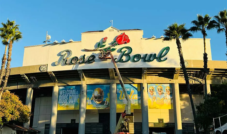 worker refurbishing historic marquee sign